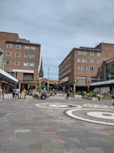 A view of Coventry's shopping precinct, 50s either side, 90s dead ahead