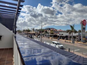 View of Main St, Corralejo, from our hotel balcony. It's a busy street with bars, restaurants and shops